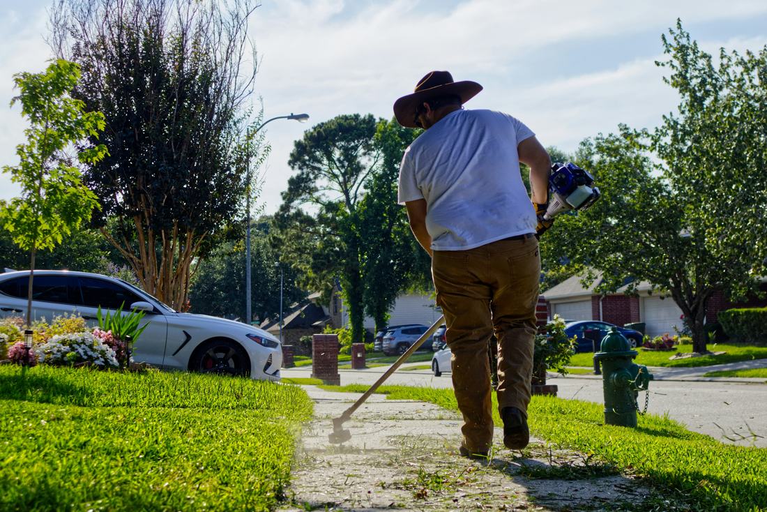 Trimming along a sidewalk