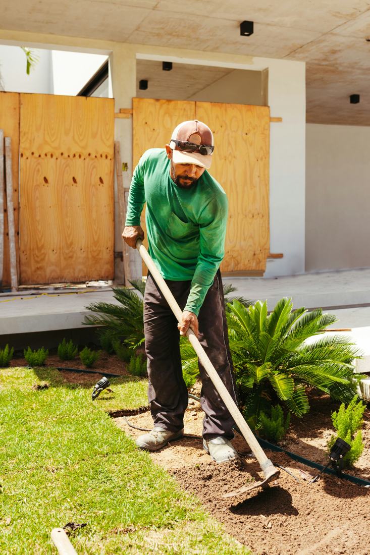 Prepping a planting bed with a hoe